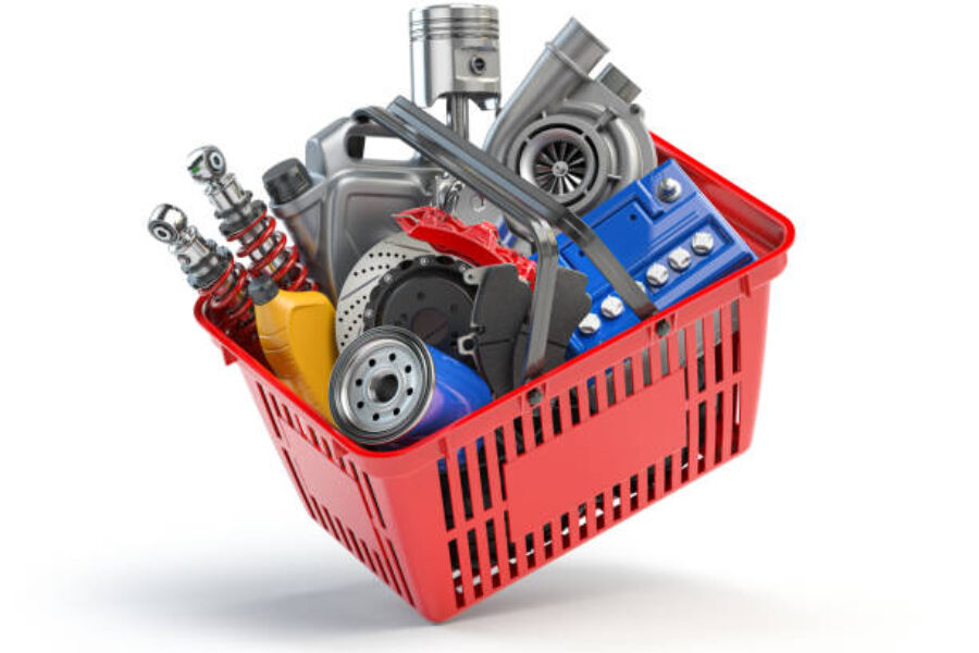 Car parts and auto spare in shopping basket isolated on white. 3d illustration